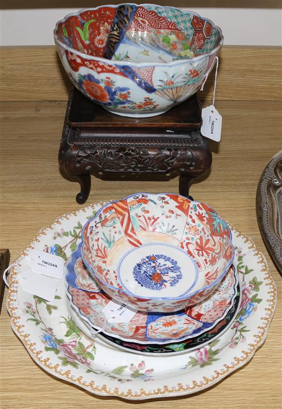 A Chinese carved hardwood stand, two Imari bowls and a similar dish and two other items,